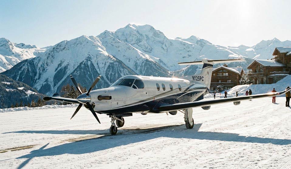 Pilatus Pc-12 Private Aircraft Parked On The Snowy Runway At Courchevel Altiport