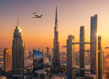 Private jet flying over Dubai skyline illustrating the private jet Dubai to India route.