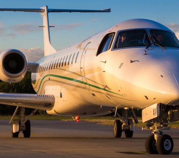 A Team Boarding Their Aircraft For A Seamless Travel Experience With Our Vip Private Jet Charter Service.